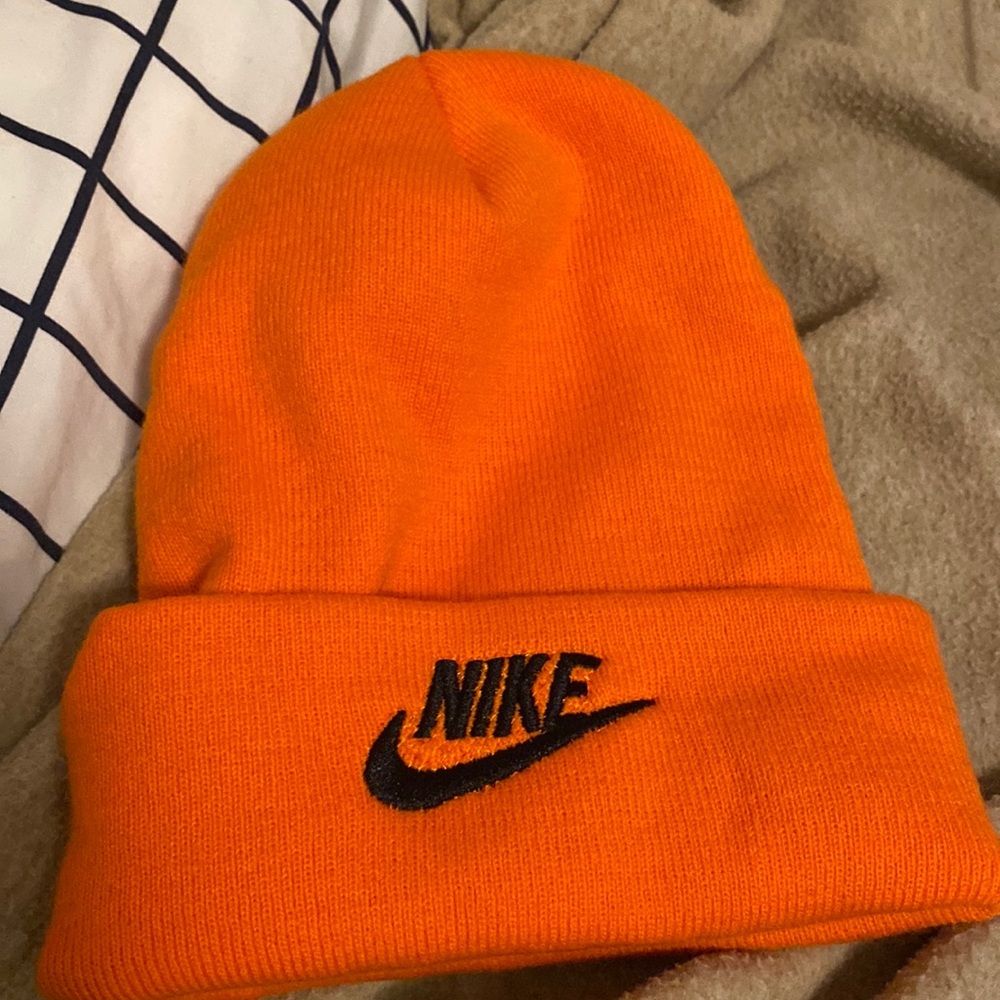 Nike orange hat.